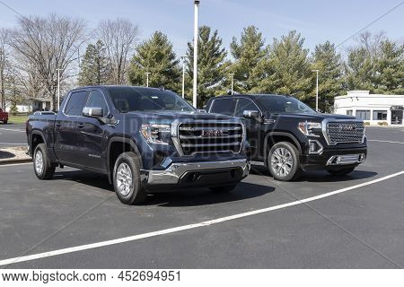 Gmc Sierra At4 And Denali Display At A Dealership. The Gmc Sierra 1500 Is Available In A Variety Of