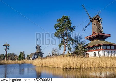 Historic Windmills And Half-timbered House At The Lake In Gifhorn, Germany