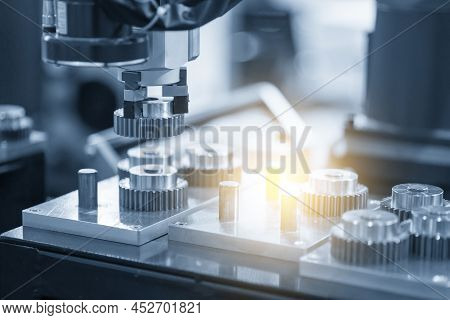 The Hi-technology  Material Handling Process By Robotic System With Metal Gear Parts. The Automatic 