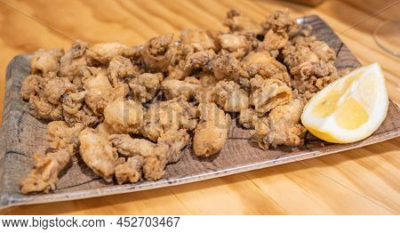 Delicious Portion Of Chopitos Or Fried And Crispy Laces With Lemon