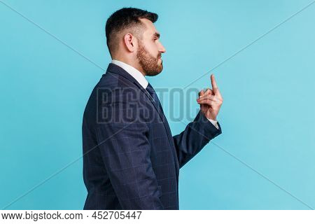 Profile Portrait Of Bearded Aggressive Hater, Angry Man Wearing Official Dark Style Suit Showing Mid