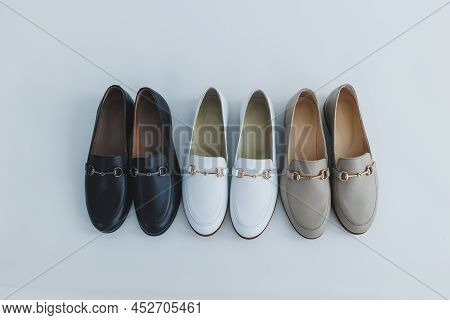 Lots Of Women's Shoes On The Floor, Different Leather Shoes. New Women's Shoes Scattered On The Floo