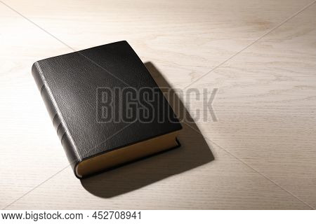 Bible On White Wooden Table, Space For Text. Christian Religious Book