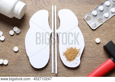 Paper Cutout With Sand, Pills And Hammer On Wooden Table, Flat Lay. Kidney Stone Disease