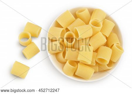 Raw Italian Pasta In Ceramic Bowl Isolated On White Background With Clipping Path . Mezze Maniche Ri