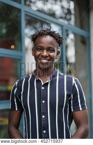 Portrait Of Happy Confident African Young Man With Trendy Casual Wear Looking To The Camera