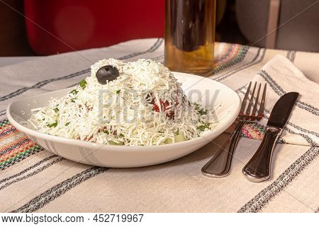 Traditional Bulgarian Shopska Salad Is On A Plate