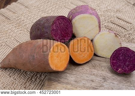 Colorful Root Vegetables Pink, Purple And Orange Organic Sweet Potatos