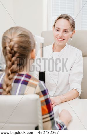 Ophthalmologist Examines The Girl On A Corneo Topographer. Modern Clinic.