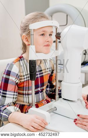 Ophthalmologist Examines The Girl On A Corneo Topographer. Modern Clinic.