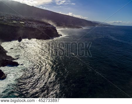 Aerial View On Black Lava Rocks And Atlantic Ocean In Small Village Punta Brava Near Puerto De La Cr