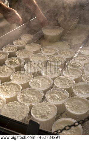 Process Of Making Fresh White Soft Ricotta Whey Cheese On Small Cheese Farm In Parma, Italy