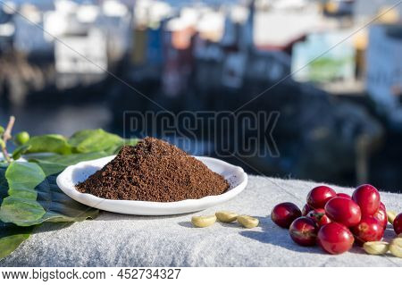 Red Ripe Arabica Coffee Berries, Green Coffee Beands, Leaves And Roasted Ground Coffee In Bowl And B