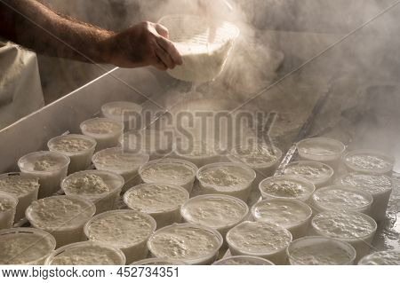 Process Of Making Fresh White Soft Ricotta Whey Cheese On Small Cheese Farm In Parma, Italy