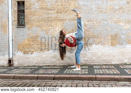 Funny Teenager Carrying Her Best Friend Piggyback On The Pavement At The Old Wall, Positive Emotions