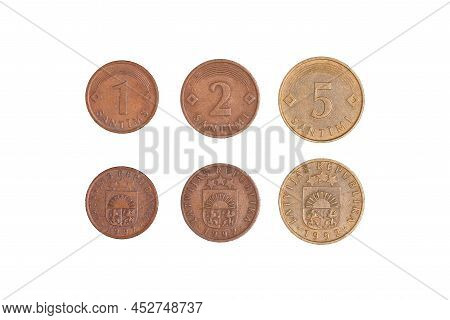1, 2, 5 Santimu, Latvian Centime Coins On A Black Background. Symbol Of Latvian Currency To Wealth A