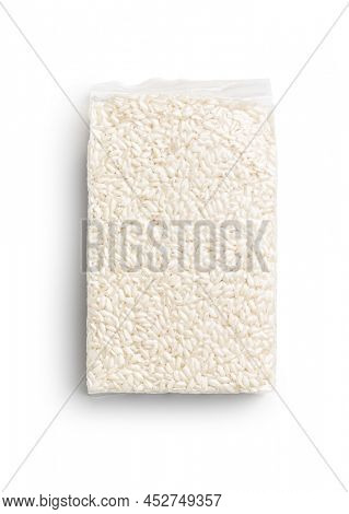 Packed Carnaroli risotto rice isolated on a white background.