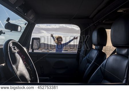 Happy And Free Alternative Adventure Travel Tourist Woman Have Fun Outside The Car With Outdoors Mou