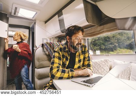 Adult Couple Travel And Enjoy Caming Car Camper Van For Holiday Vacation Or Vanlife Lifestyle - Happ