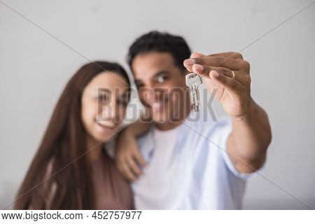 Close Up Of New Home Keys And Young Interracial Couple Smile And Show The Property - New Life Mortag