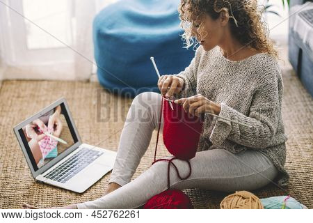 One Woman At Home Sitting On The Carpet Watch Online Knit Work Tutorial And Enjoy Woolen Knitting Ac
