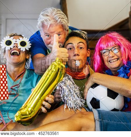 Group Of Family Friends Football Supporter Exult Watching Match On Tv - Caucasian Mixed Ages Young A