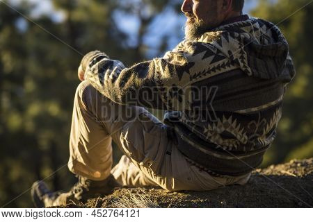 Back Of Man Relaxing And Admiring Scenic Forest From Rocky Hill. Hiker Admiring Forest View From Hil