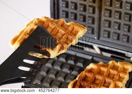 Waffles Made With Croissant Dough, Croffles. Cooking In A Homemade Waffle Iron