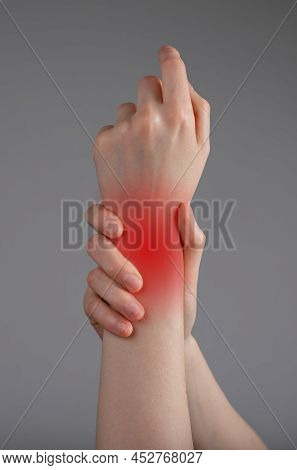 Wrist Pain. Painful Hand With Red Spot Closeup. Sprain, Fracture. Arthritis, Office Syndrome. Health