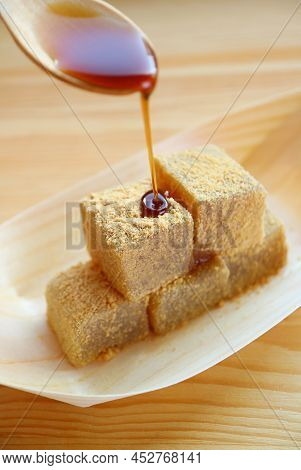 Japanese Traditional Confection Called Warabimochi Poured On Top With Kuromitsu Syrup