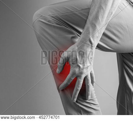 Shin Splints. Man Holding Painful Leg With Red Spot Closeup. Overuse Injury, Cramp, Medial Tibial St