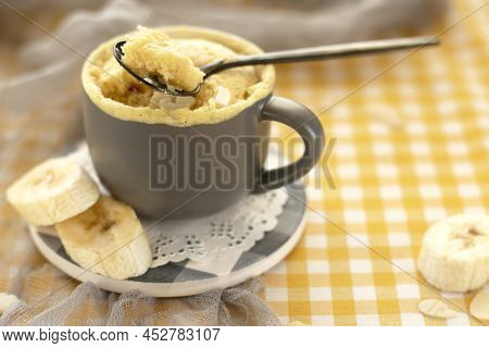 Homemade Portioned Banana Bread Mugcake In Small Mugs.