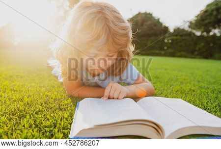 Cute Childr Boy With Books Outdoors. Summer Camp. Kids Learning And Education Concept.