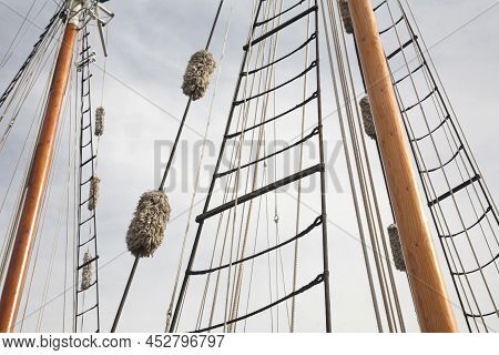 Rope Ladders Of The Antique Sailing Boat With The Sky On The Background