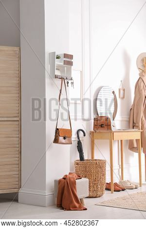 Modern Hallway Interior With Stylish Dressing Table And Key Holder