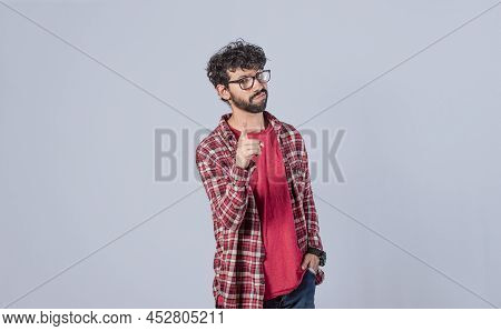 Man Pointing To The Front With His Finger, Serious Man Pointing To The Front On Isolated Background,
