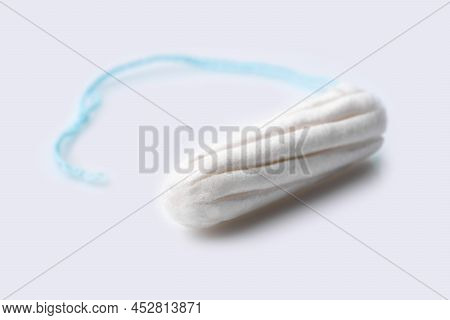 Medical Female Tampon On A Pink Background. Hygienic White Tampon For Women. Cotton Swab. Menstruati