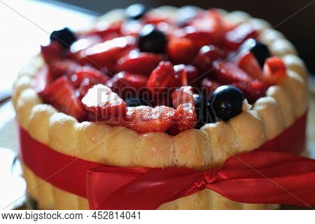Delicious Floury Sweet Cake With Strawberries And Currants. Cooking Cake At Home Concept
