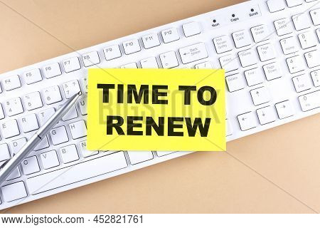 Text Time To Renew Text On Sticky On Keyboard, Business Concept