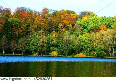 Colorful Autumn Forest At The Blue Caldera, Holzmaar Near Gillenfeld