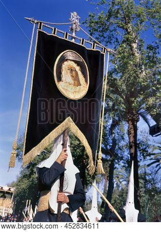 Malaga,spain-april,08 2012: Carrying A Banner In The Processions Held To Celebrate Semana Santa (eas
