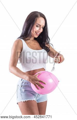 Brunette Woman Hodling A Balloon And A Fork To Stab The Balloon To Show A Pain Relieve From Stomach 
