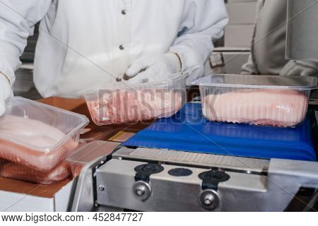 Modern Poultry Processing Plant.meat Processing In Food Industry.packing Of Meat Slices In Boxes On 