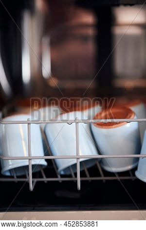 The Process Of Washing Yogrut Jars In The Dishwasher. Homemade Yogurt Making. Vertical Photo.