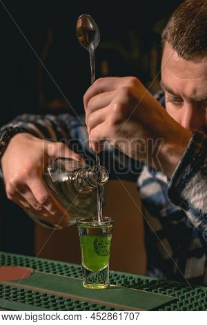 Focused Bartender Preparing Traditional Layered Shot Drink Green Mexican