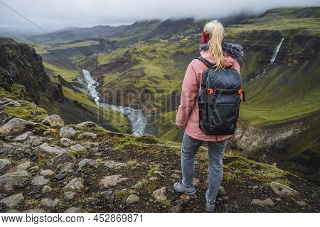 Close Up Of A Woman With Backpack Enjoying Icelandic Highland And River Fossa Close To Haifoss Water