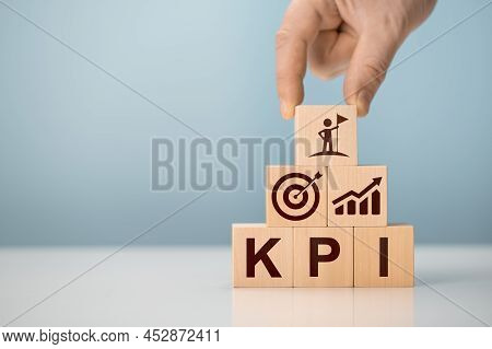 Kpi - Key Performance Indicator. Businessman Holds Cube With Kpi Icon, Kpi Key Performance Indicator
