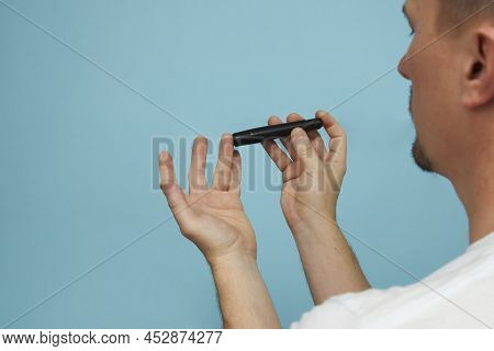 Man With Lancet Pen Doing Diabetes Test, Close-up