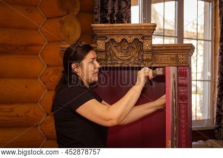 Woman Painting With Brush Door Of Antique Cupboard For Kitchen With Beautiful Ornaments. Re-usage Of