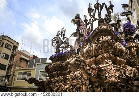 Elche, Spain- April 13, 2022: Easter Parade With Bearers And Penitents Through The Streets Of Elche 